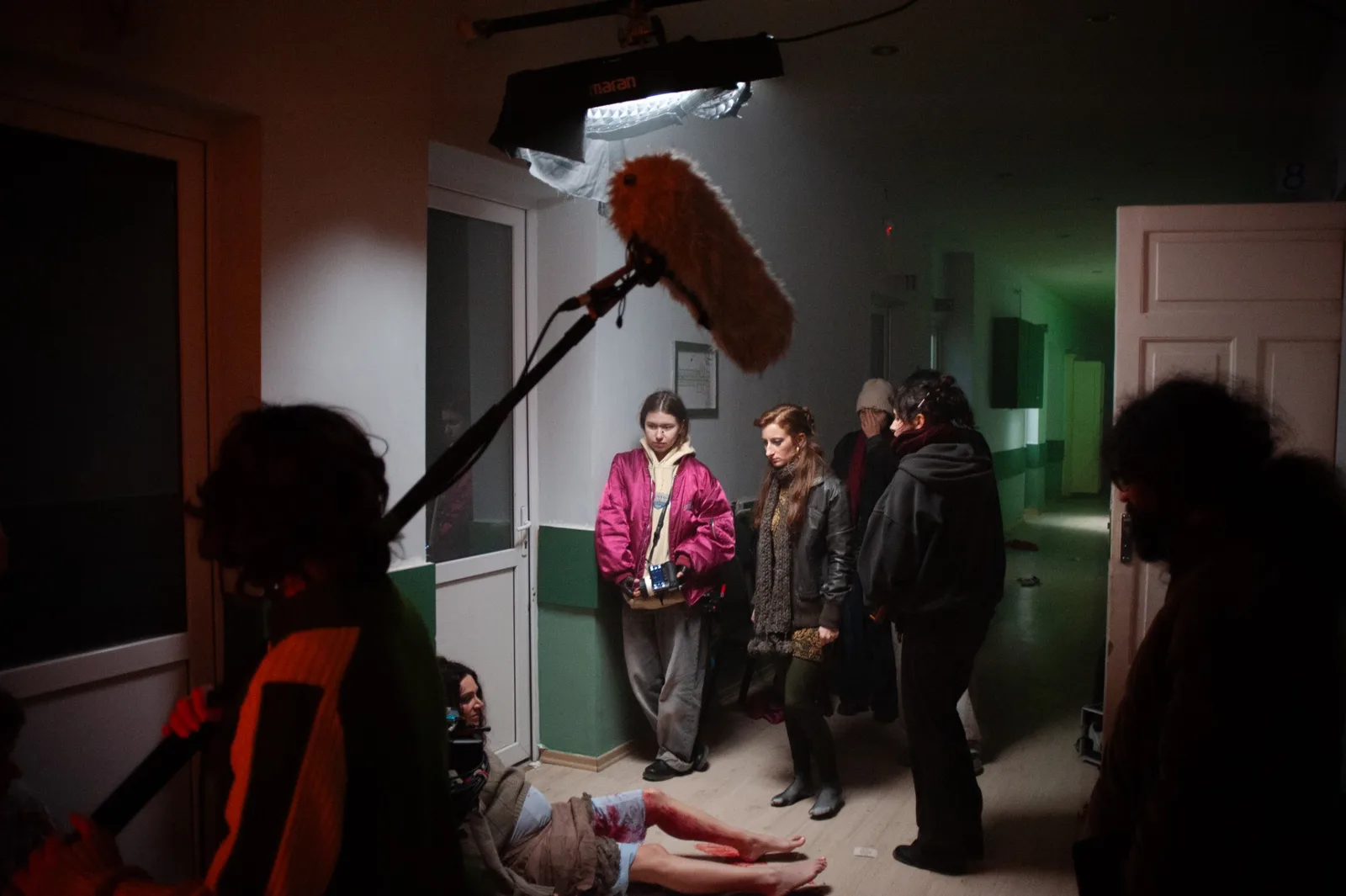 Holy Smear set: boom operator and crew in the hospital corridor during a take