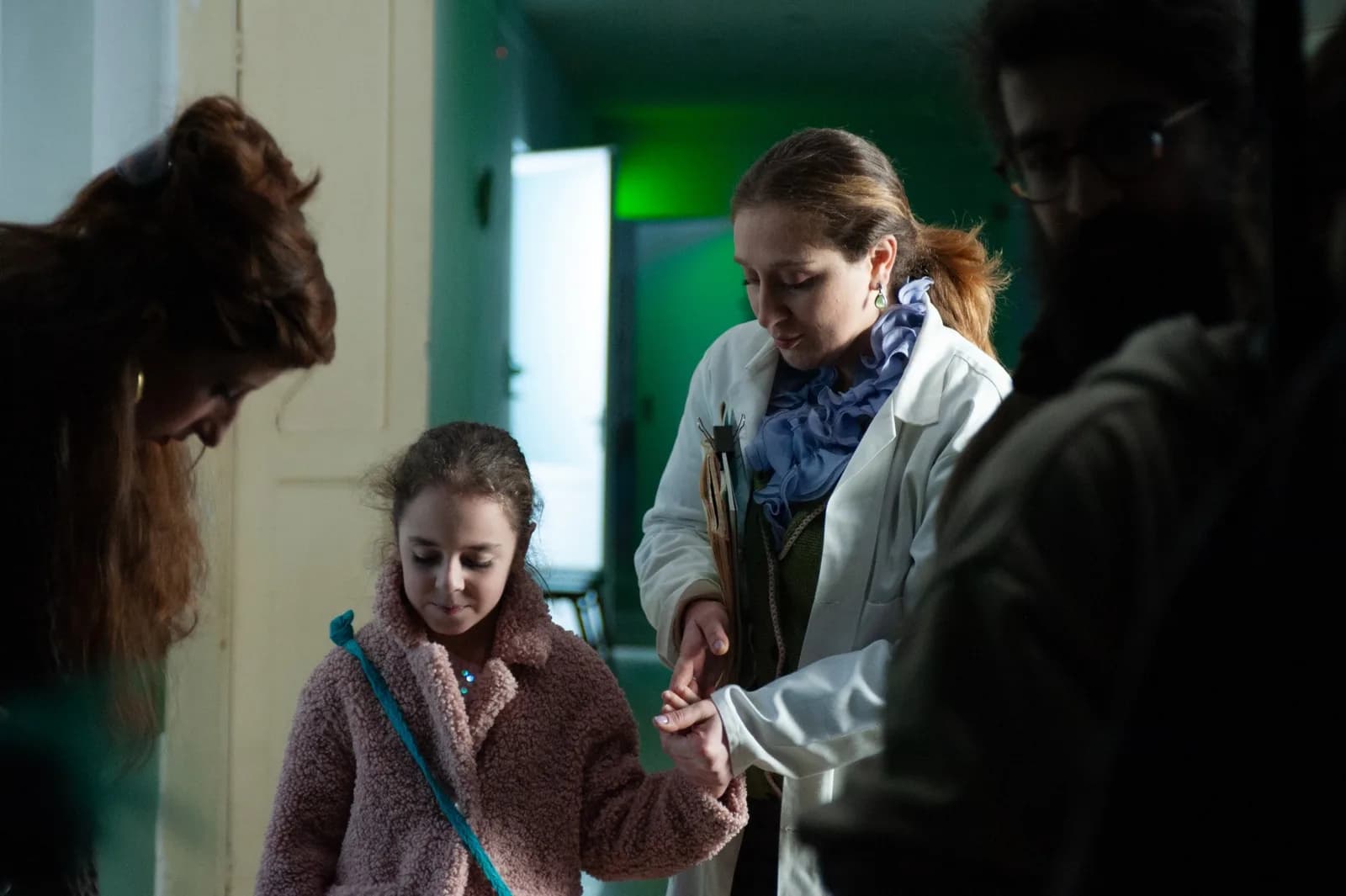 Holy Smear set: an actor in a doctor's coat rehearsing with a child actor