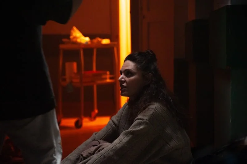 Holy Smear still: a patient in a dim ward