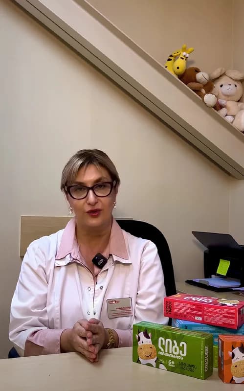Video still: partner pediatrician at her desk with Liebe packs