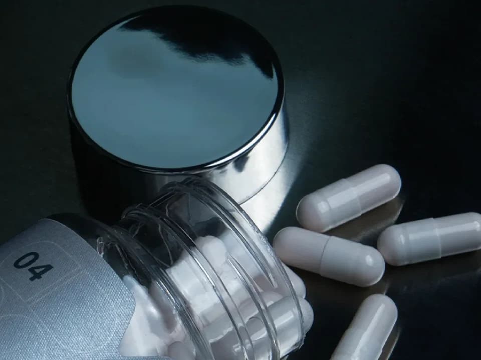 Metallic detail: the mirror-finish cap of a Velvia capsule bottle